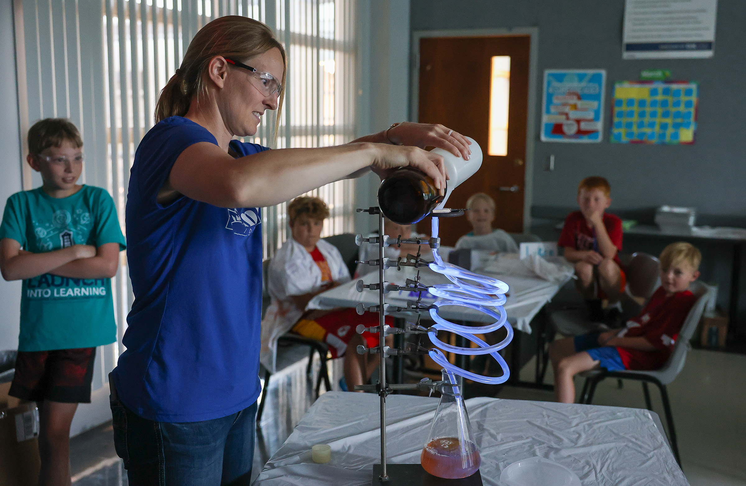 Annette Moser conducts an experiment during Loper Launch Enrichment Camp.