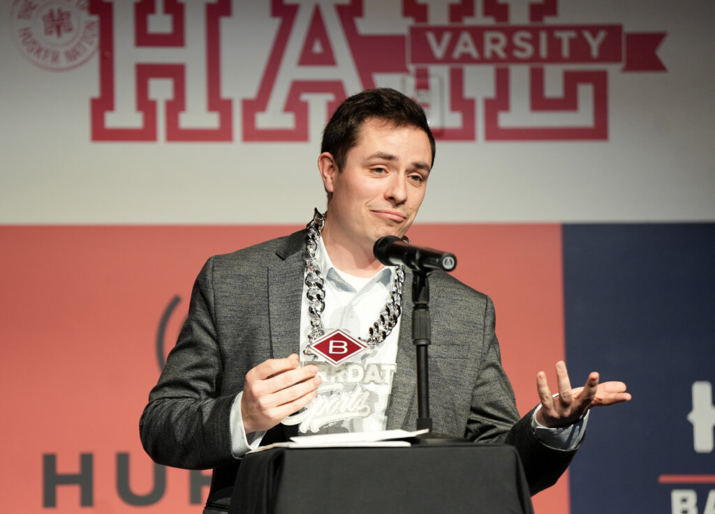 Austin Jacobsen wearing the "Big Game Chain" at a Hurrdat Sports event.