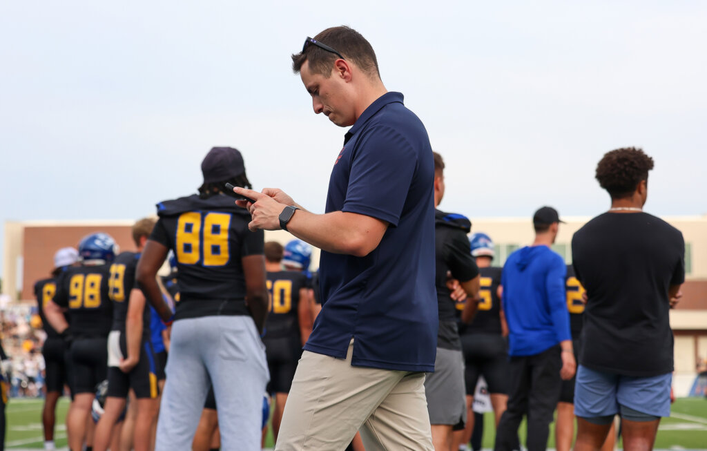 Austin Jacobsen covering the UNK-Wayne State football game at Cope Stadium.