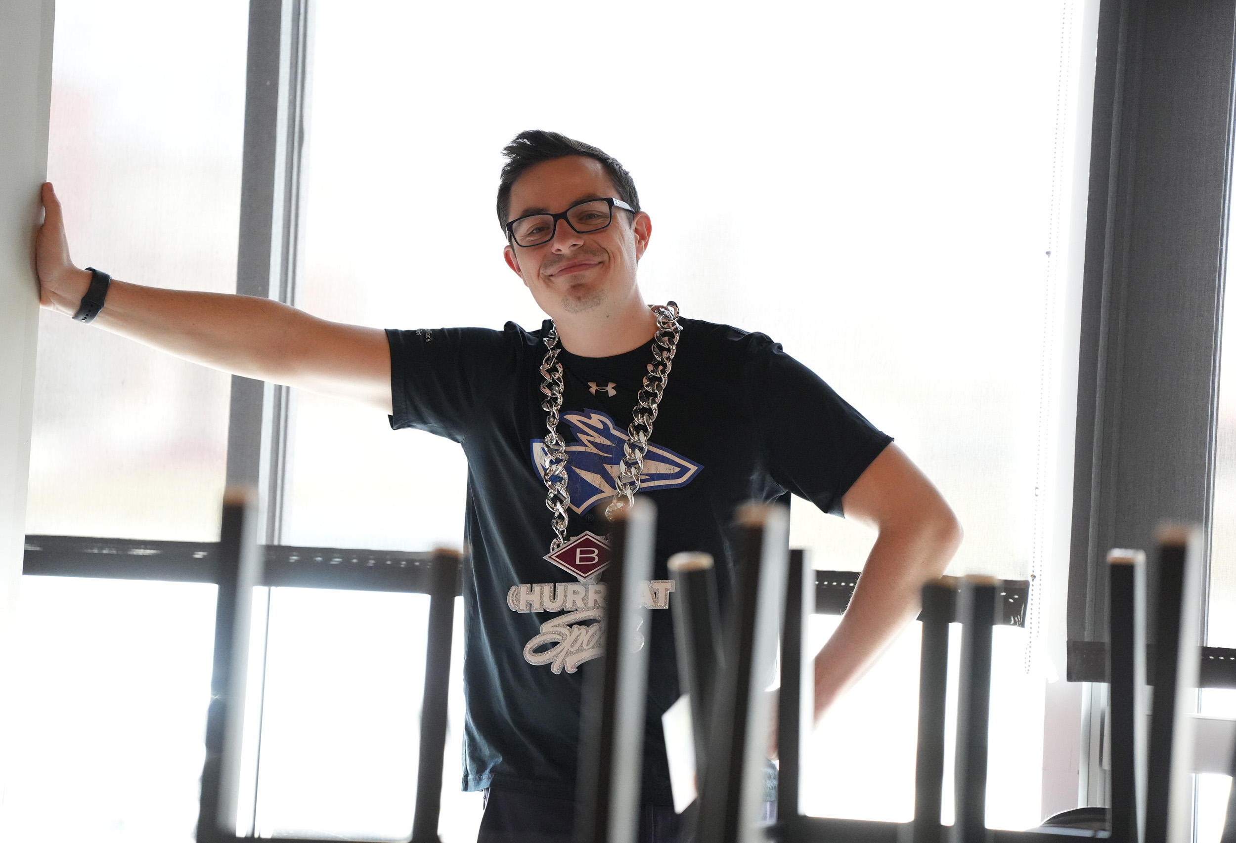 Austin Jacobsen wearing a UNK shirt and the Hurrdat Sports "Big Game Chain."