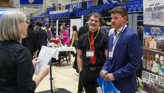 UNK students meet with an employer during the Career and Internship Fair.
