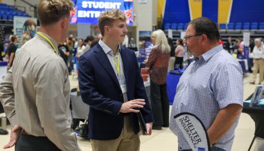 UNK students meet with an employer during the Career and Internship Fair.