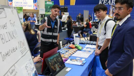 UNK students meet with an employer during the Career and Internship Fair.