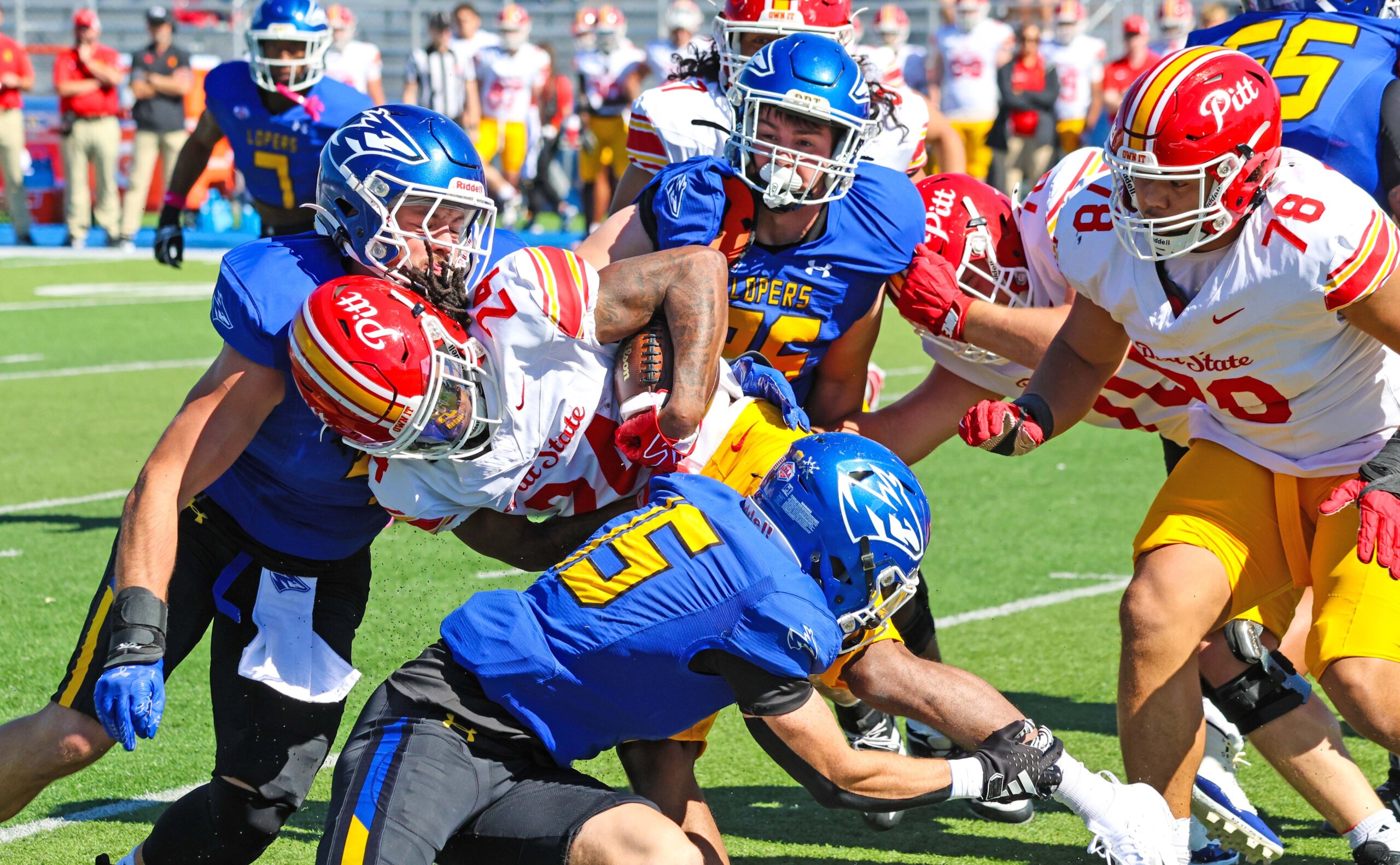 The Lopers make a tackle.