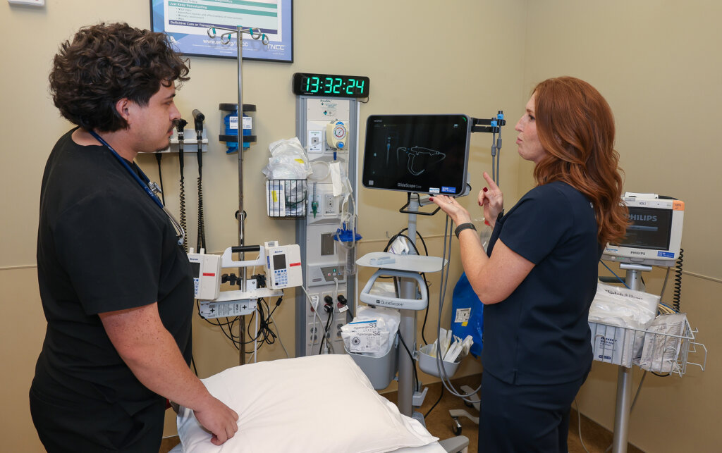 Dr. Hilary Miller works with a student completing a rotation at Valley County Health System.