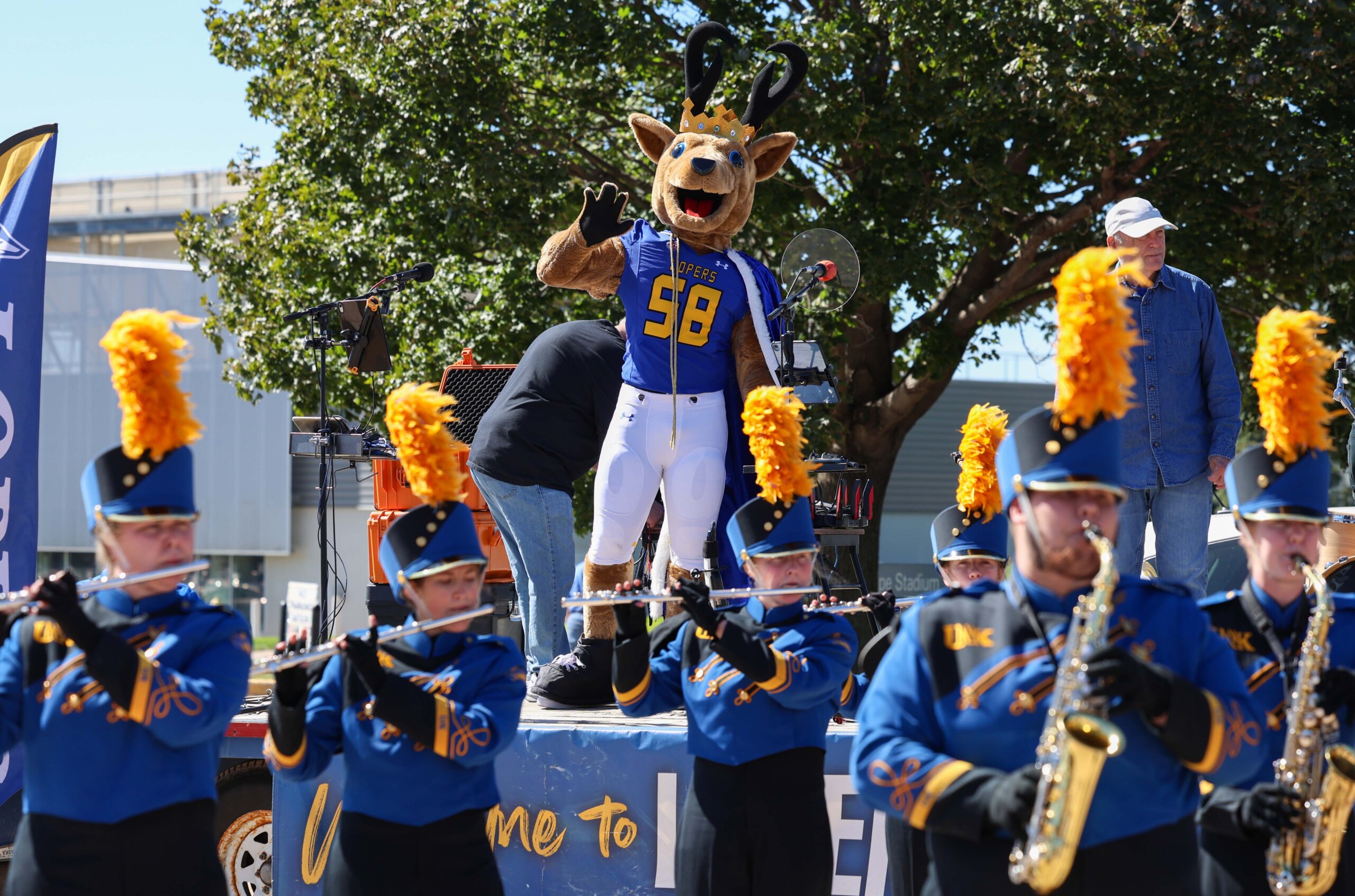 The Pride of the Plains Marching Band performs at the tailgate.