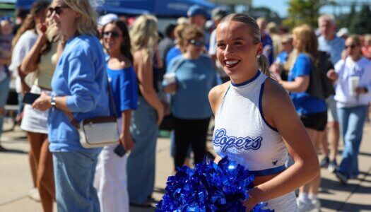 UNK Sapphire Makinley Mitchell smiles at the tailgate.