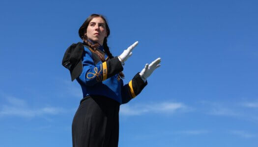Drum major Samantha Bursaw directs the marching band.