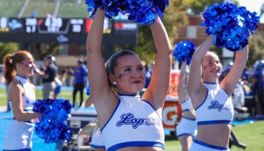The Sapphires Dance Team cheers on the Lopers from the sidelines.
