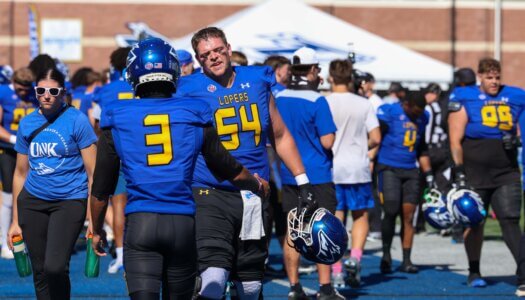 Carter Klein shakes his teammate's hand.