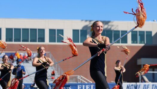 The Pride of the Plains Marching Band performs at halftime.