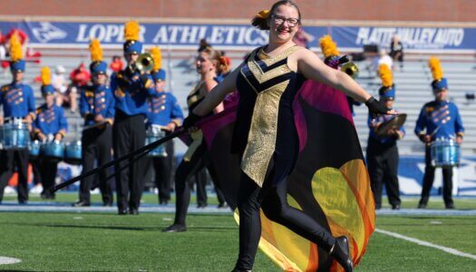 The Pride of the Plains Marching Band performs at halftime.