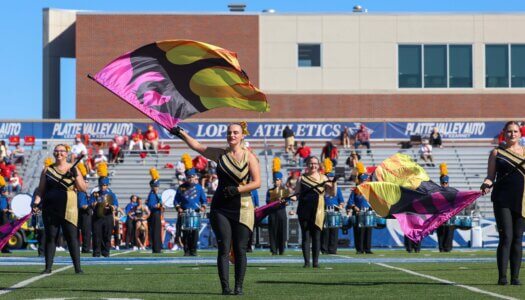 The Pride of the Plains Marching Band performs at halftime.