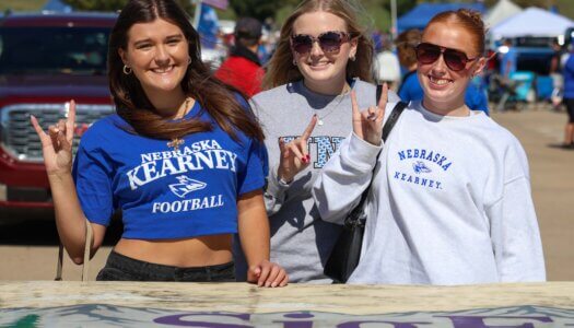 Students throw their Lopes at the tailgate.