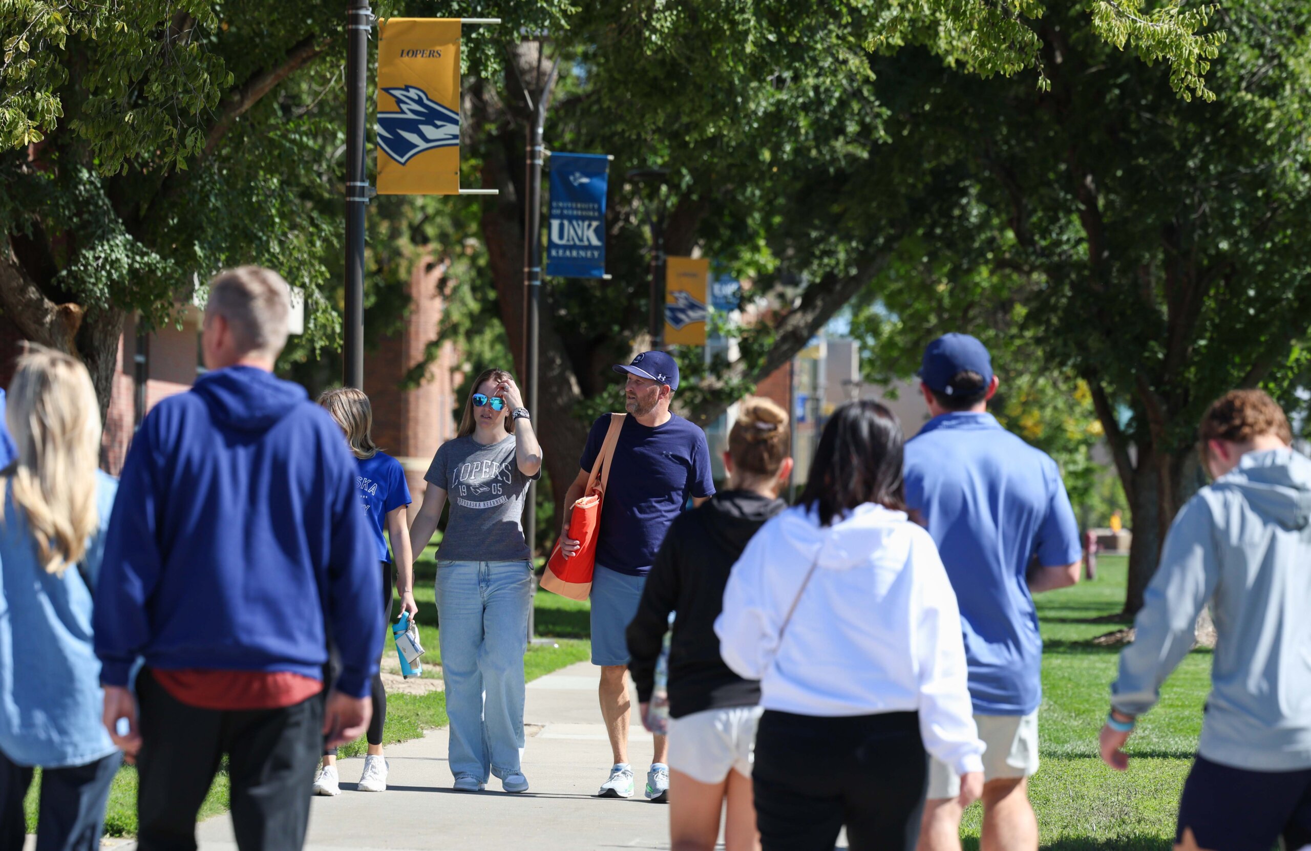 Fans walk the campus.