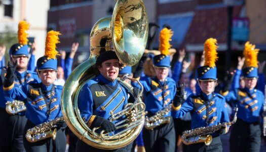 The Pride of the Plains Marching Band plays in the parade.