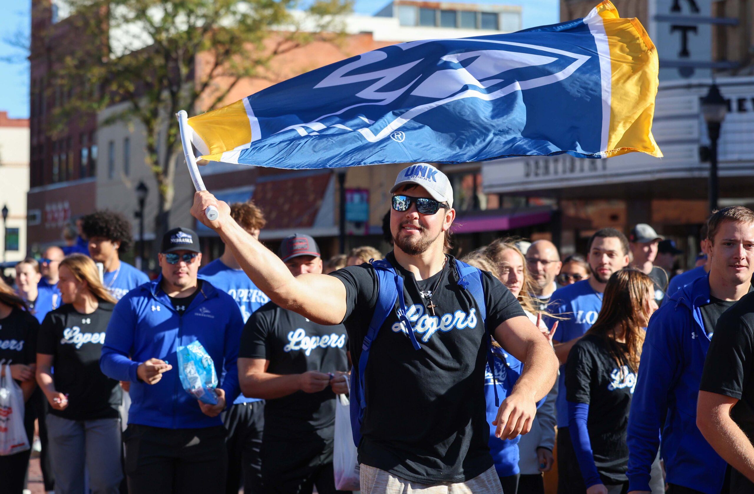 A student waves a flag.