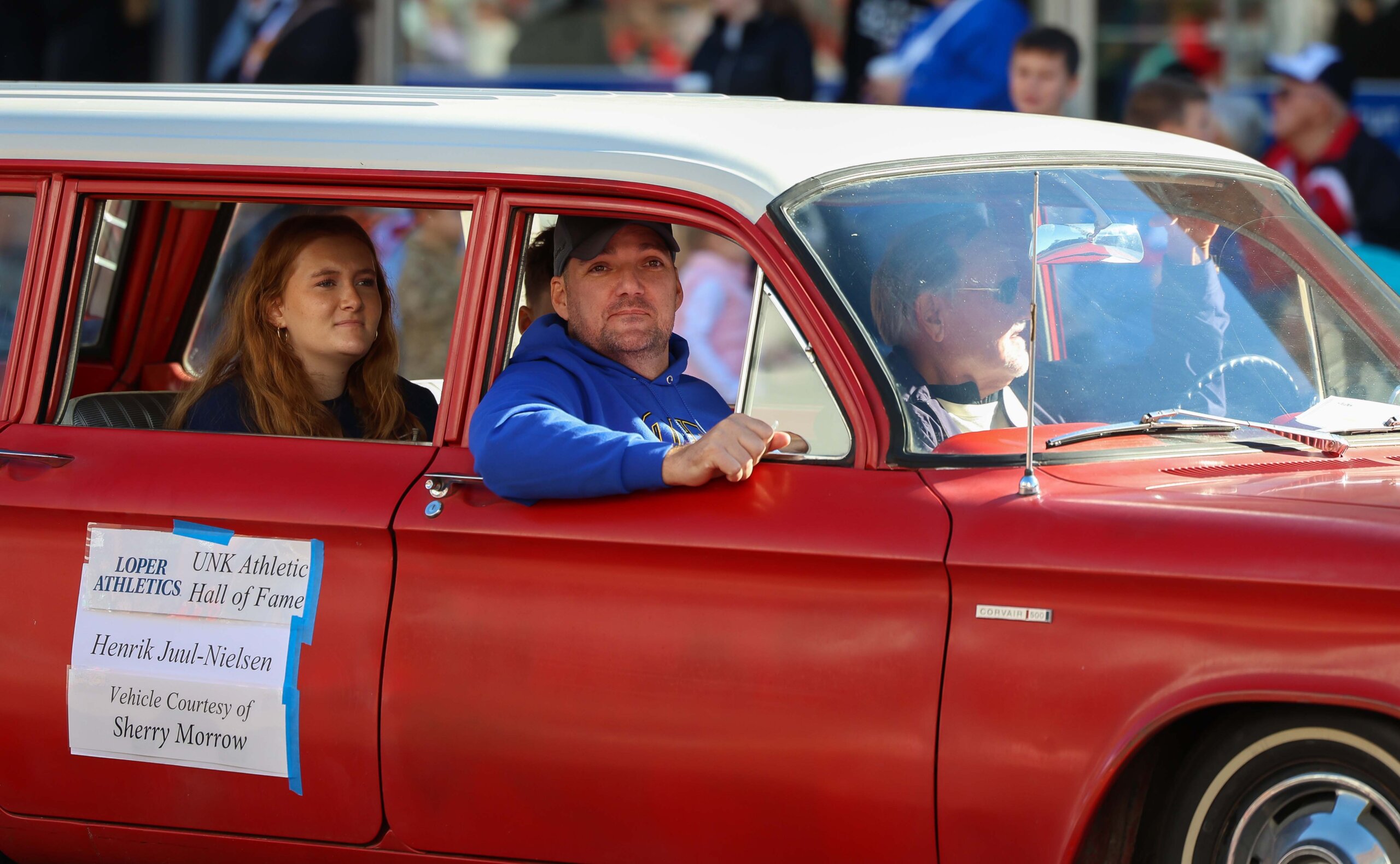 Loper Athletics Hall of Famer Henrik Juul-Nielsen rides in the parade with his family.