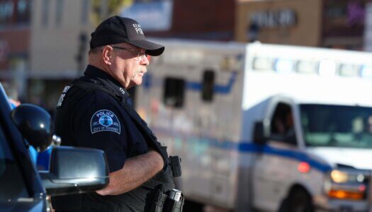 A Kearney Police Officer watches the parade.