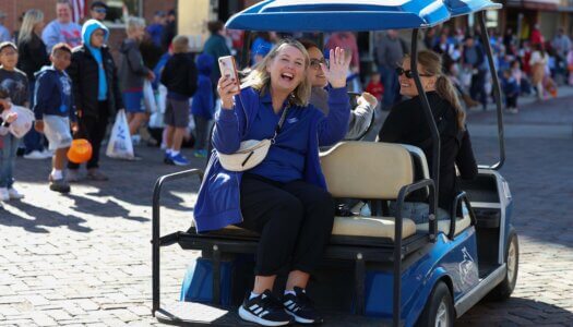 Student Engagement Director Renae Zimmer rides in the parade.