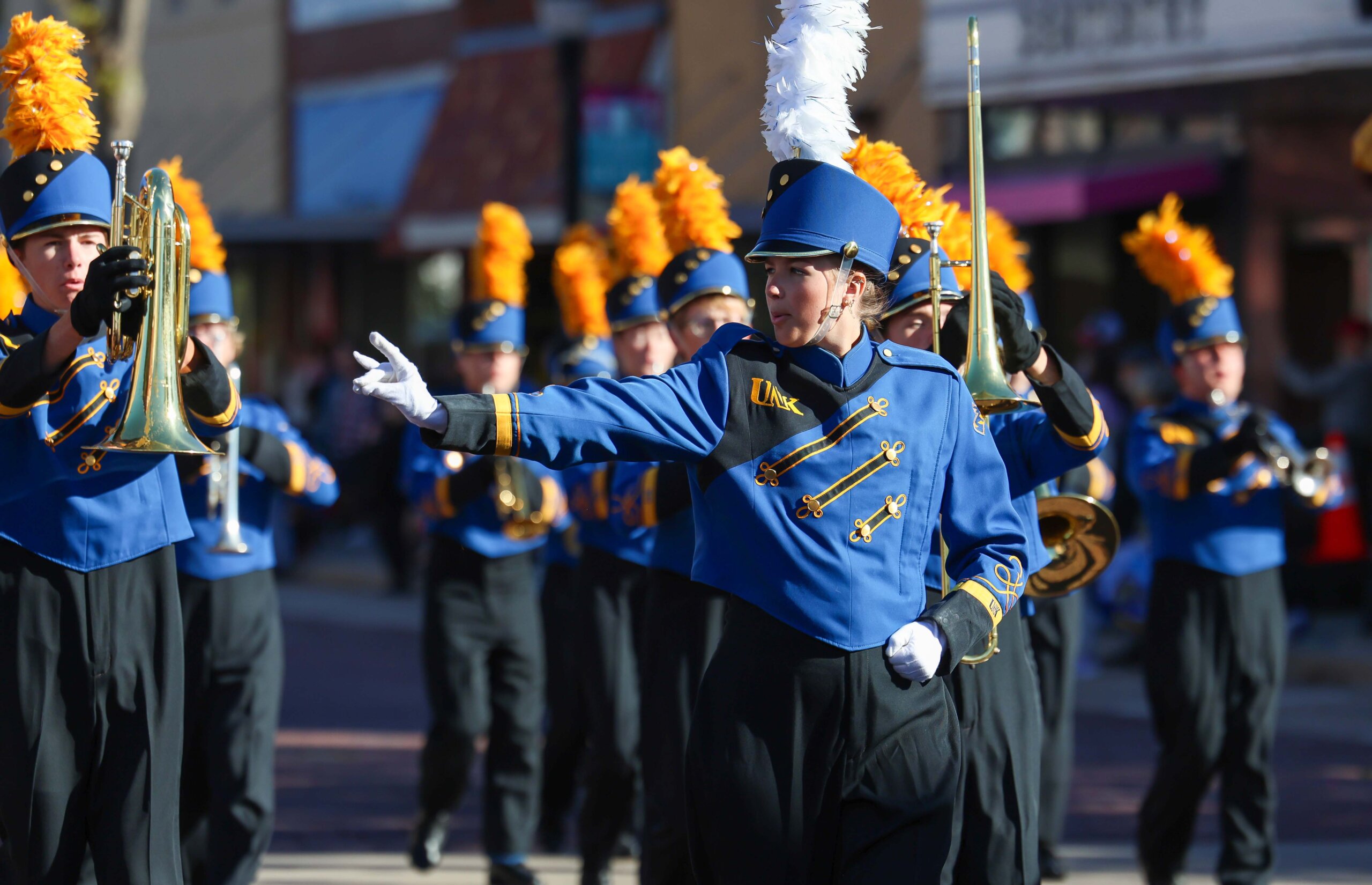 A drum major throws her Lopes.