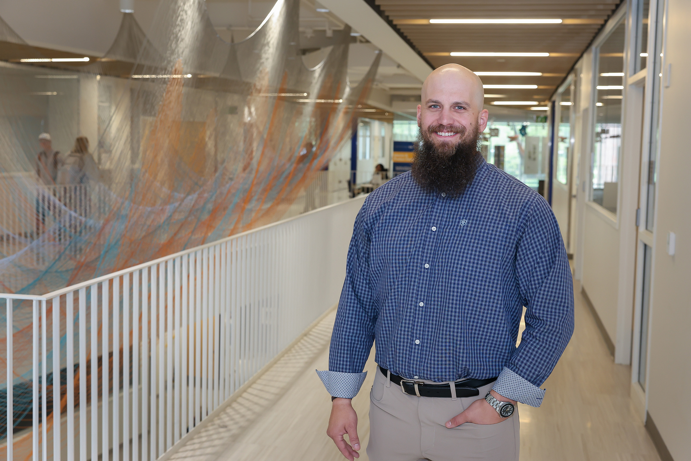 JD Stone poses for a photo inside Discovery Hall on the UNK campus.