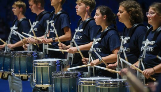 The UNK drum line performs.