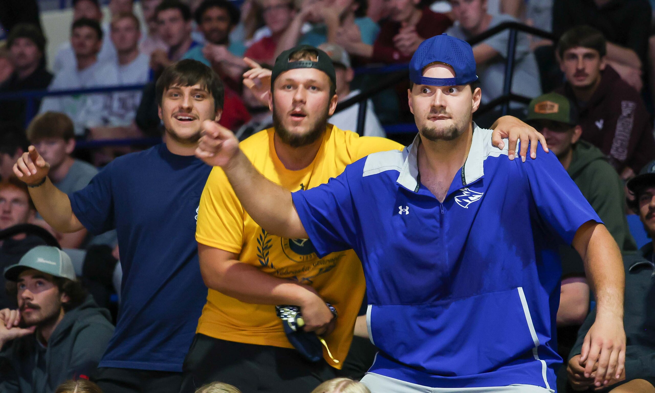 Students dance in the stands.
