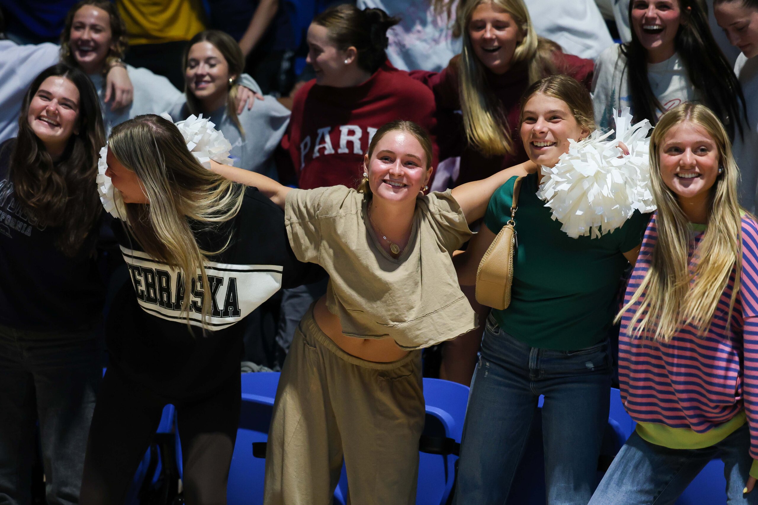 Students dance in the stands.