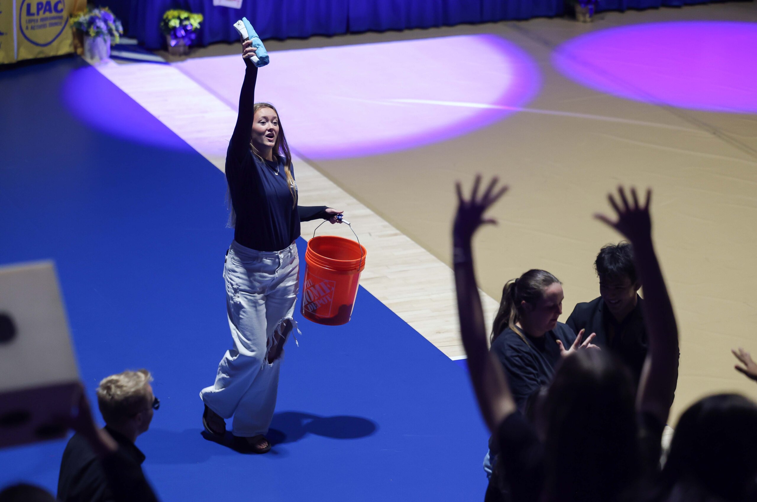 A student throws a T-shirt to the crowd.
