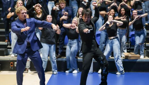 Students dance on the gym floor.