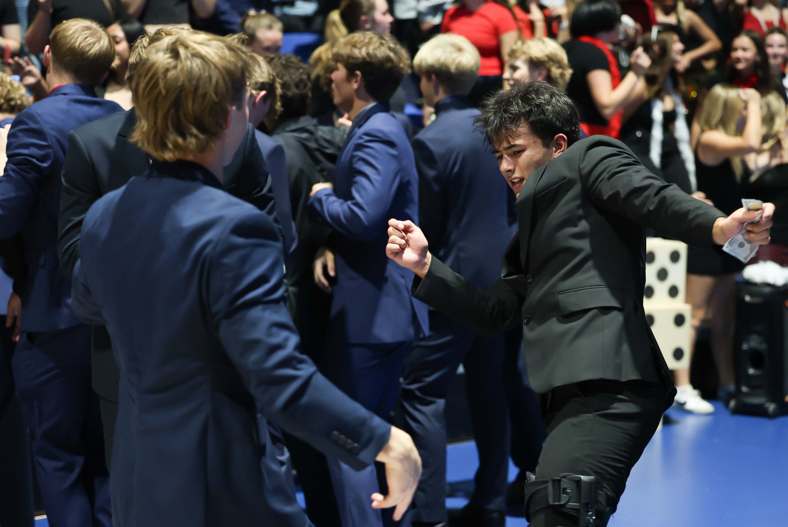 Students dance in the stands.