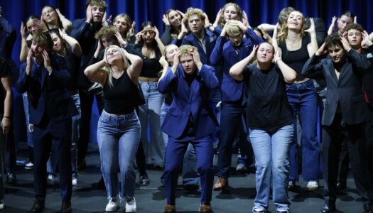Students perform a routine.