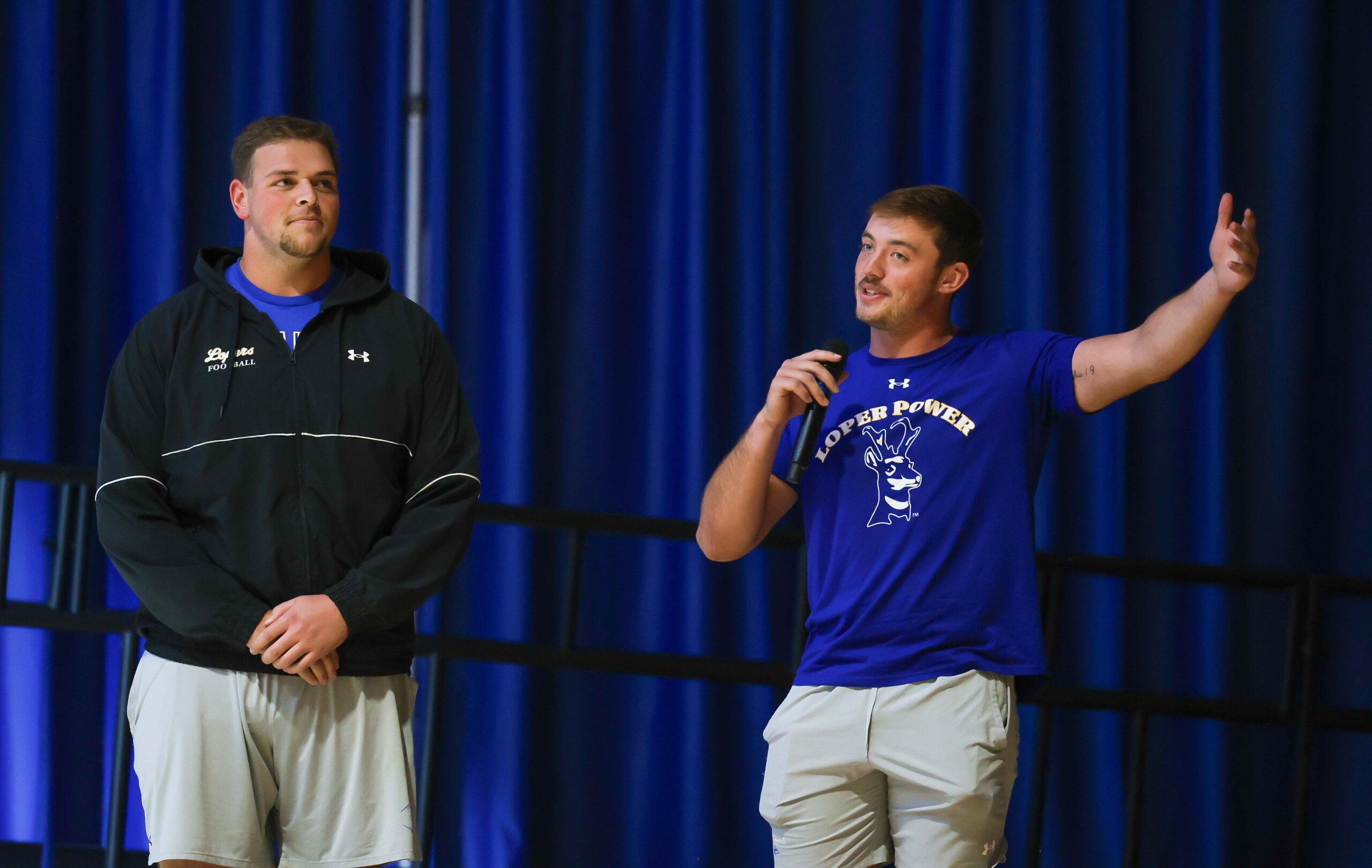 Students speak to the crowd.