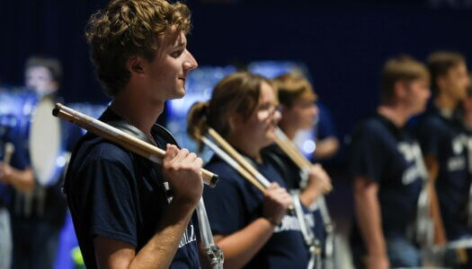 The UNK drum line performs.
