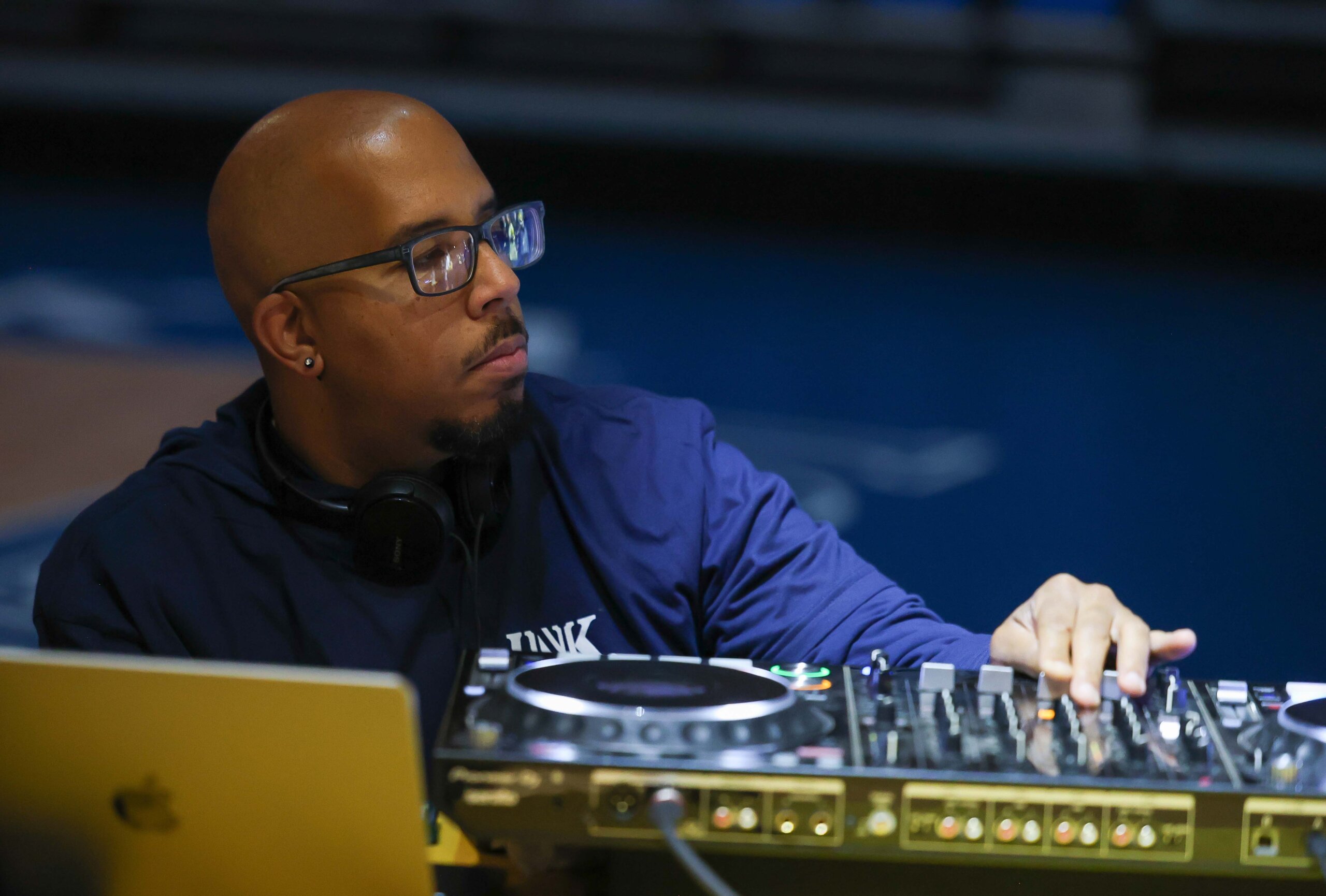 A man plays music on a turntable.