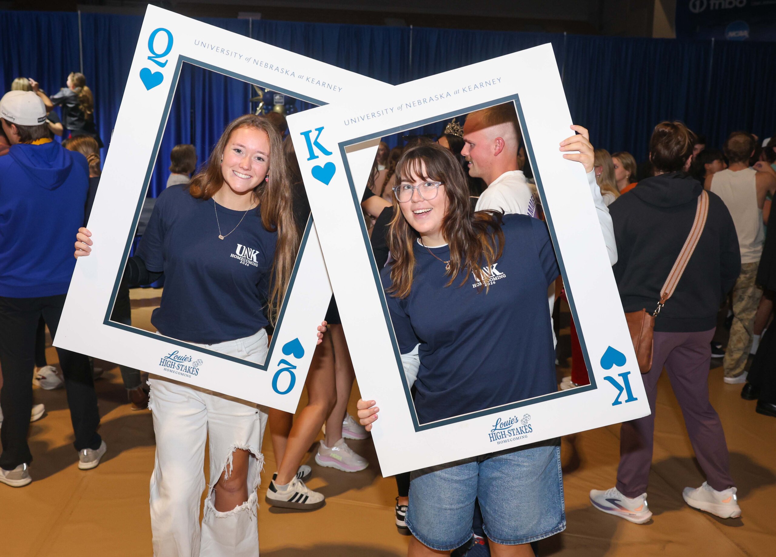 Students pose with playing card cutouts.