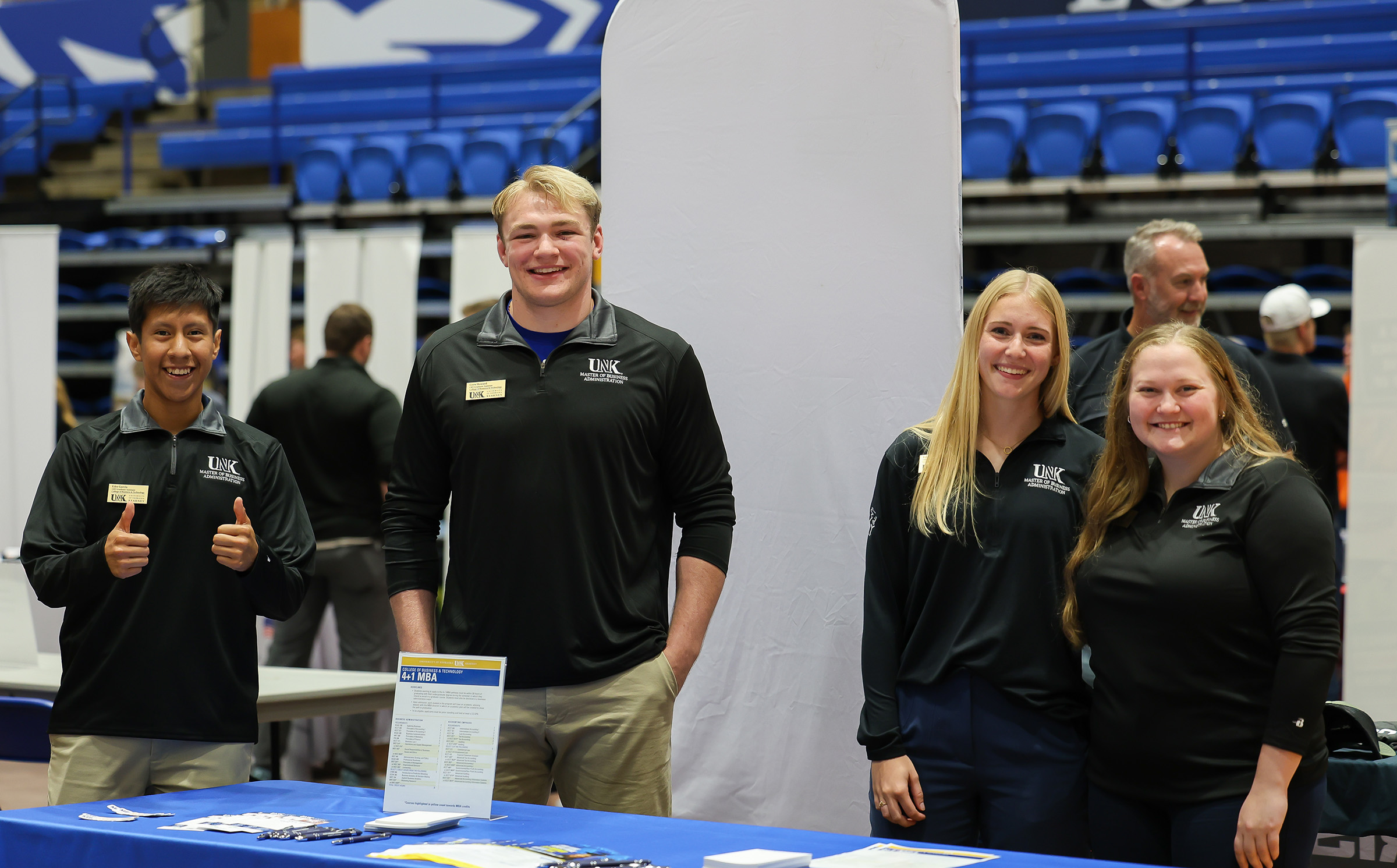 Sydney Owen represents the UNK MBA program at a campus career fair.