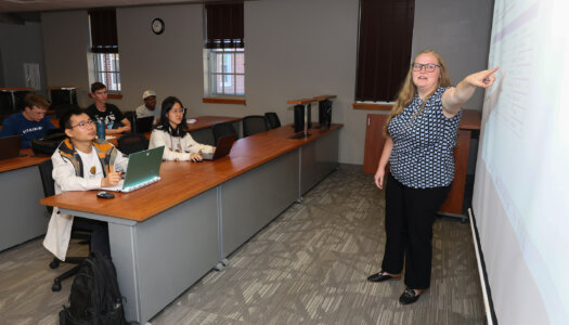 Sydney Owen teaches an accounting course at UNK.